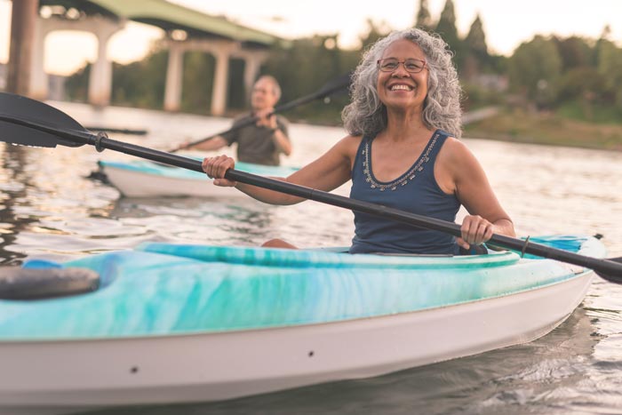 woman smiling in kayak