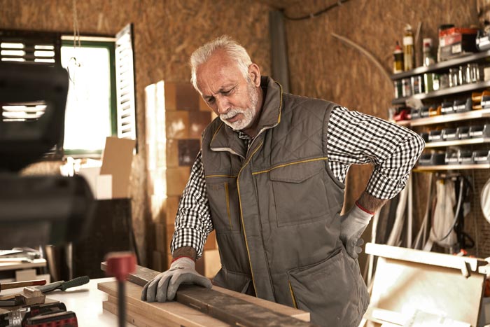 carpenter holding lower back